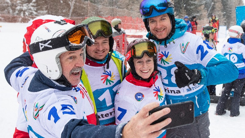 Jeff selfie with a group of skiers