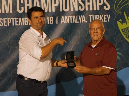 Yakup Ümit Kihtir and Howard Gorrell holding medal award while posing for picture.